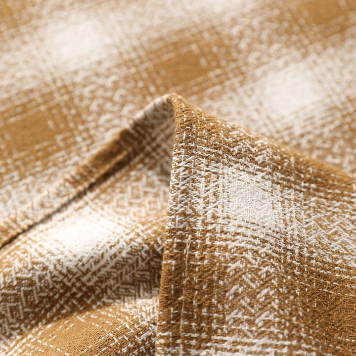 Square tablecloth made of cotton blend fabric with checkered weave pattern and pom-pom corners Kalsten