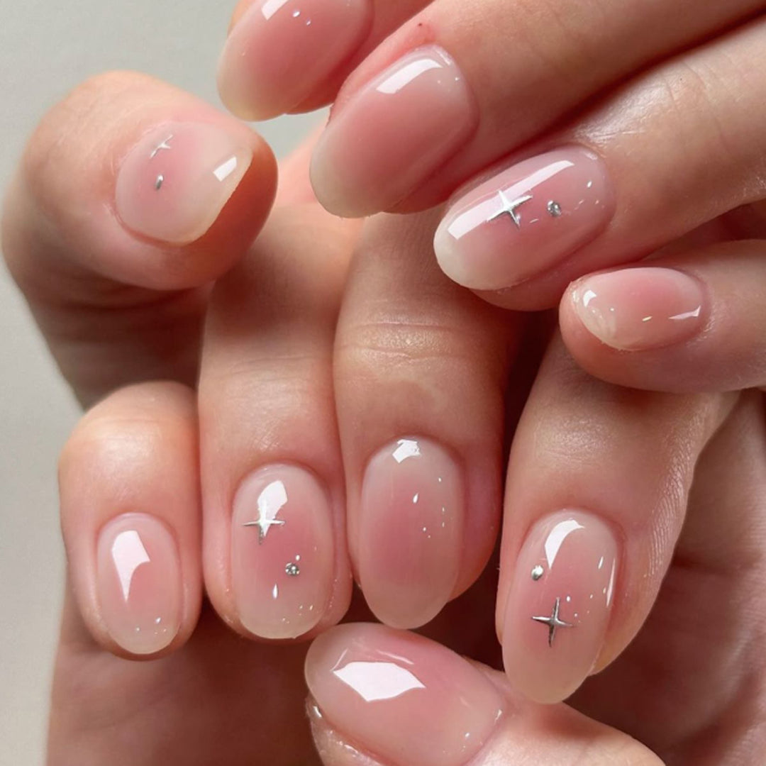Artful nail extensions with shiny rhinestone accents Kalsten