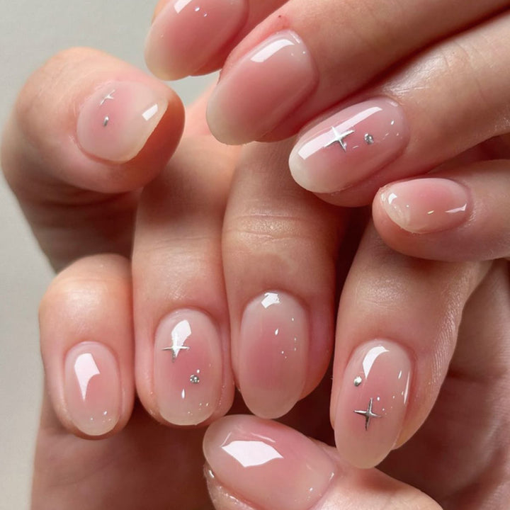 Artful nail extensions with shiny rhinestone accents Kalsten