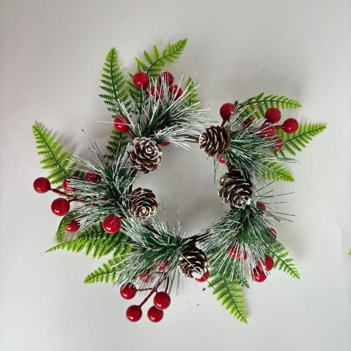 Christmas wreath with pine cones and red berries