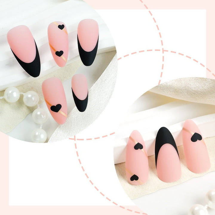 Creative nail art set with heart-shaped accents and elegant French tips Kalsten