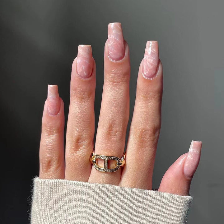 Elegant Nail Extensions with Marbled Accents Kalsten