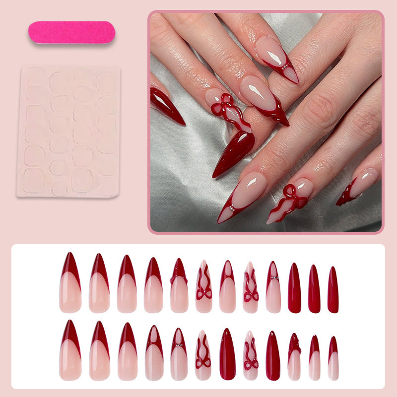 Artificial nails with elegant pointed designs and creative embellishments Kalsten
