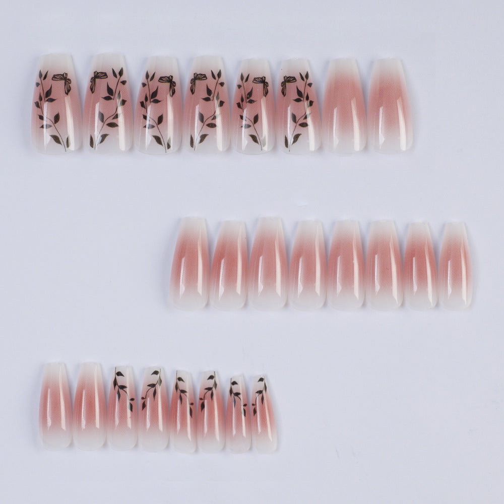 Artificial nails with elegant ombre design and floral accents Kalsten