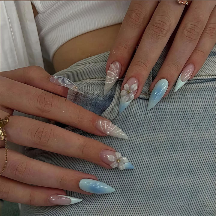 Stiletto nails with floral design and glitter accents Kalsten