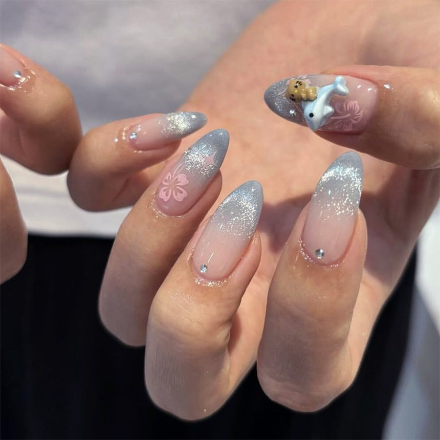 Artful nail extensions with elegant ombré design and floral accents Kalsten