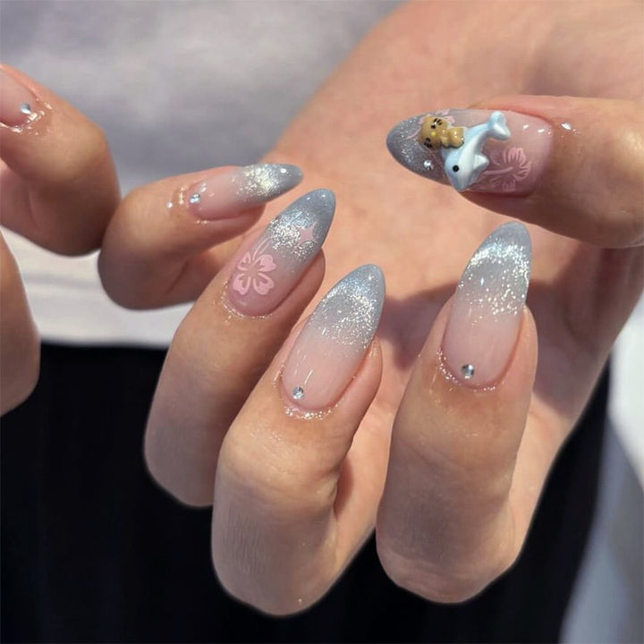Artful nail extensions with elegant ombré design and floral accents Kalsten