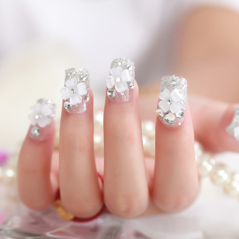 Artificial nails with glitter and floral 3D accents Kalsten