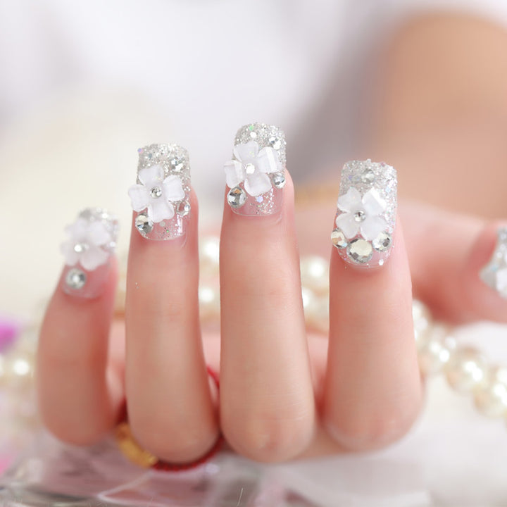 Artificial nails with glitter and floral 3D accents Kalsten