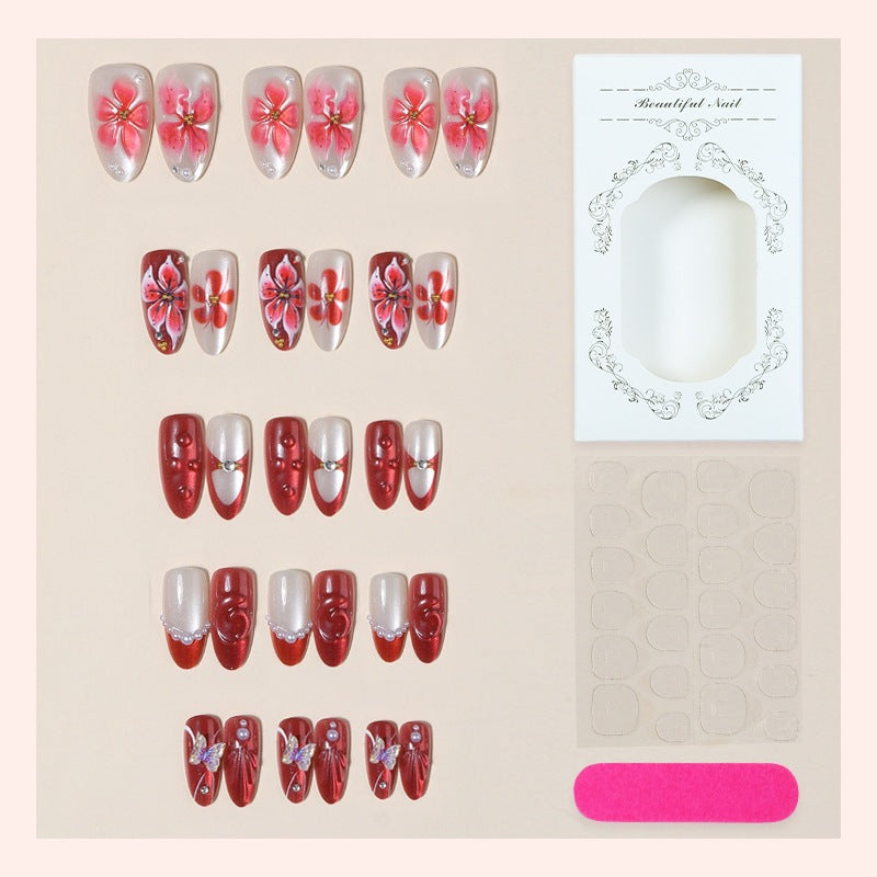 Artificial nail set with floral designs and glamorous accents Kalsten