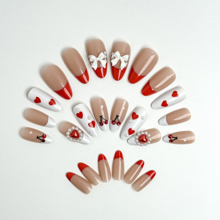 Creative nail art with heart and cherry motifs Kalsten
