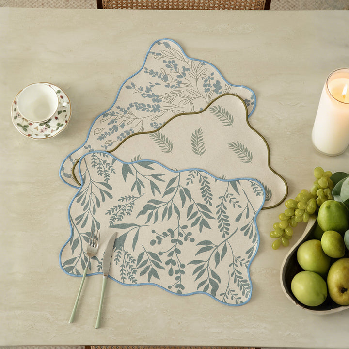 Shaped table set with curved contour and botanical leaf pattern Kalsten