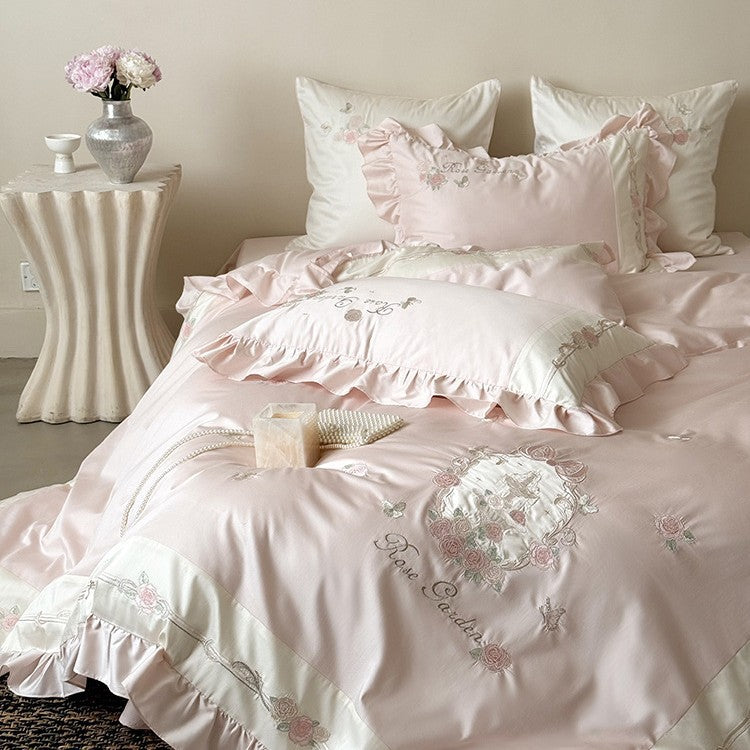 Delicate embroidered cotton satin bedding set with ruffle, satin trim, and rose motif
