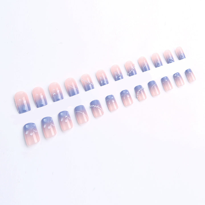 Nail set with elegant floral accents and glitter embellishments Kalsten