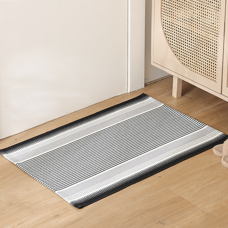 Striped cotton doormat with non-slip bottom and decorative woven edge Kalsten