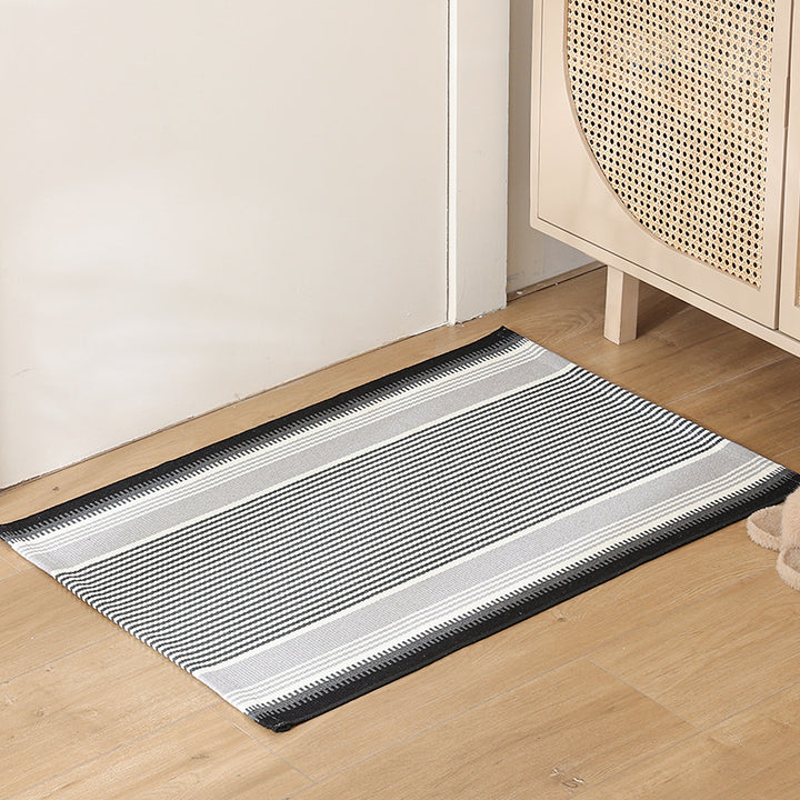 Striped cotton doormat with non-slip bottom and decorative woven edge Kalsten
