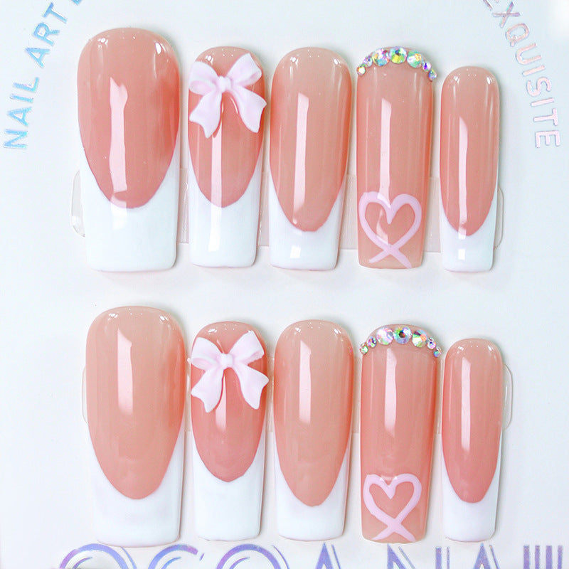 Artifical nail set with playful bow and heart designs Kalsten