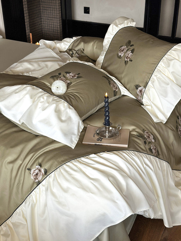 Luxurious satin bedding set with floral embroidery and frills