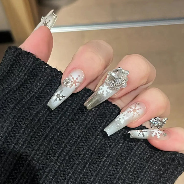 Artificial nail set with frosty snowflake design and sparkling 3D applications Kalsten