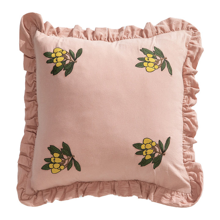 Square decorative pillow with ruffled edges and hand-stitched flower appliqués
