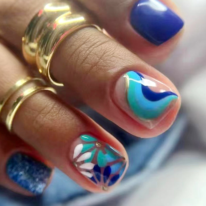 Artful nail design with floral and geometric patterns Kalsten