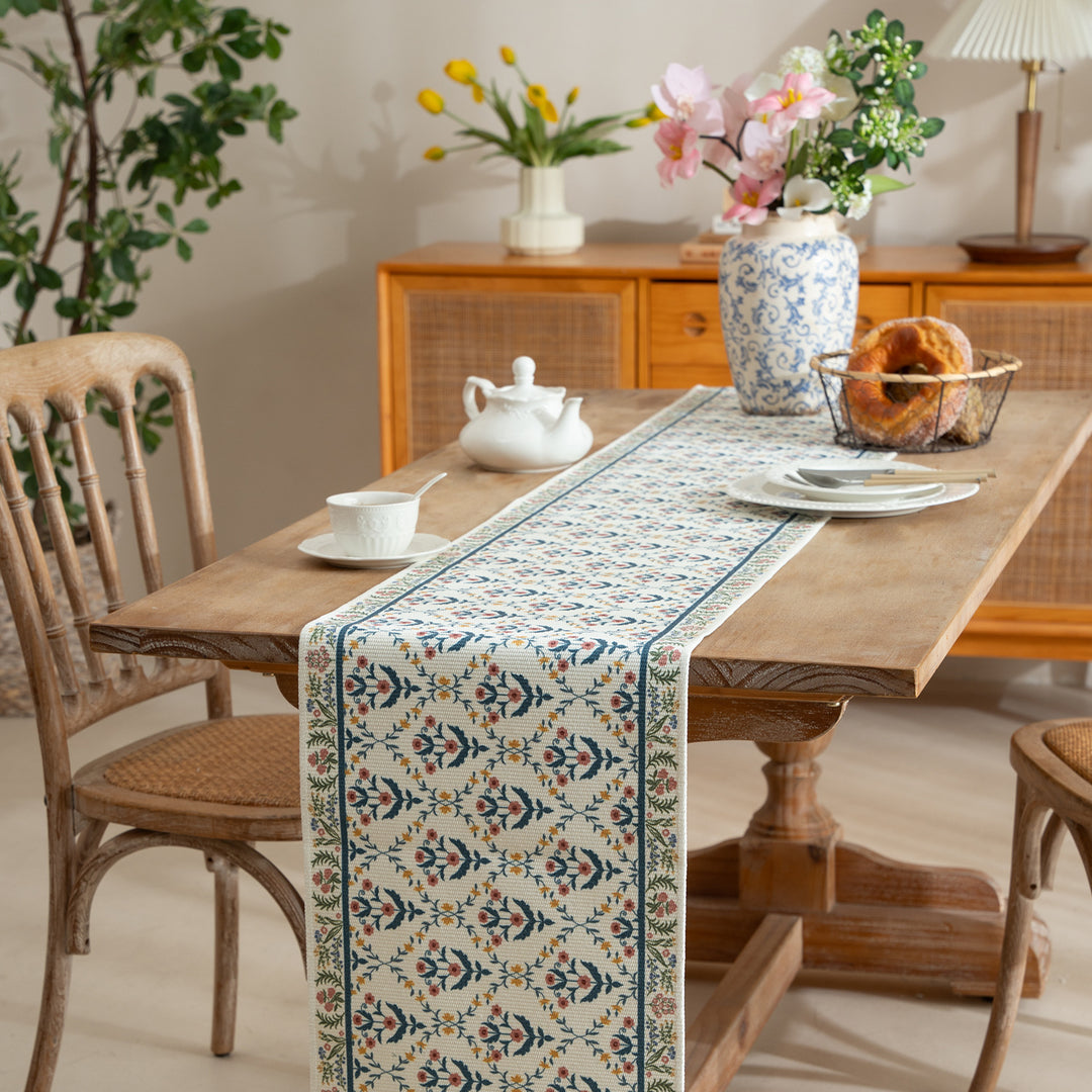 Vintage-inspired woven table runner with floral border and fringes Kalsten