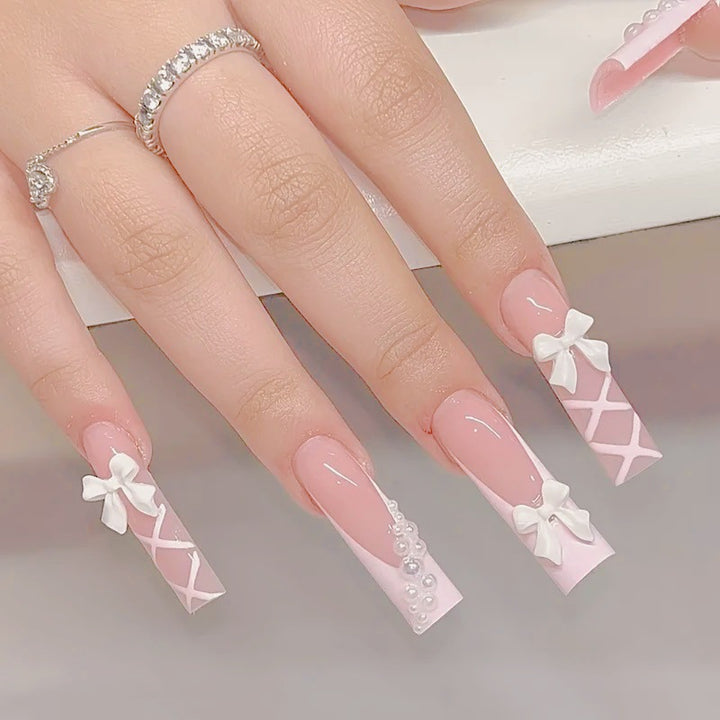 Artificial nail set with elegant 3D bows and pearl embellishments Kalsten