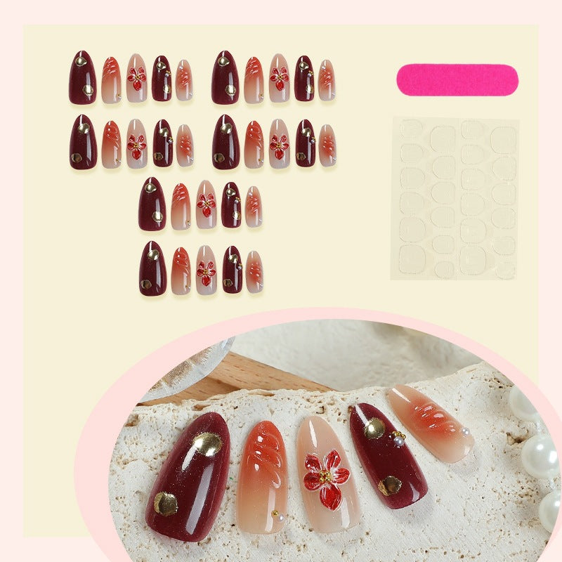 Acrylic nail set with elegant floral design and shimmering accents Kalsten
