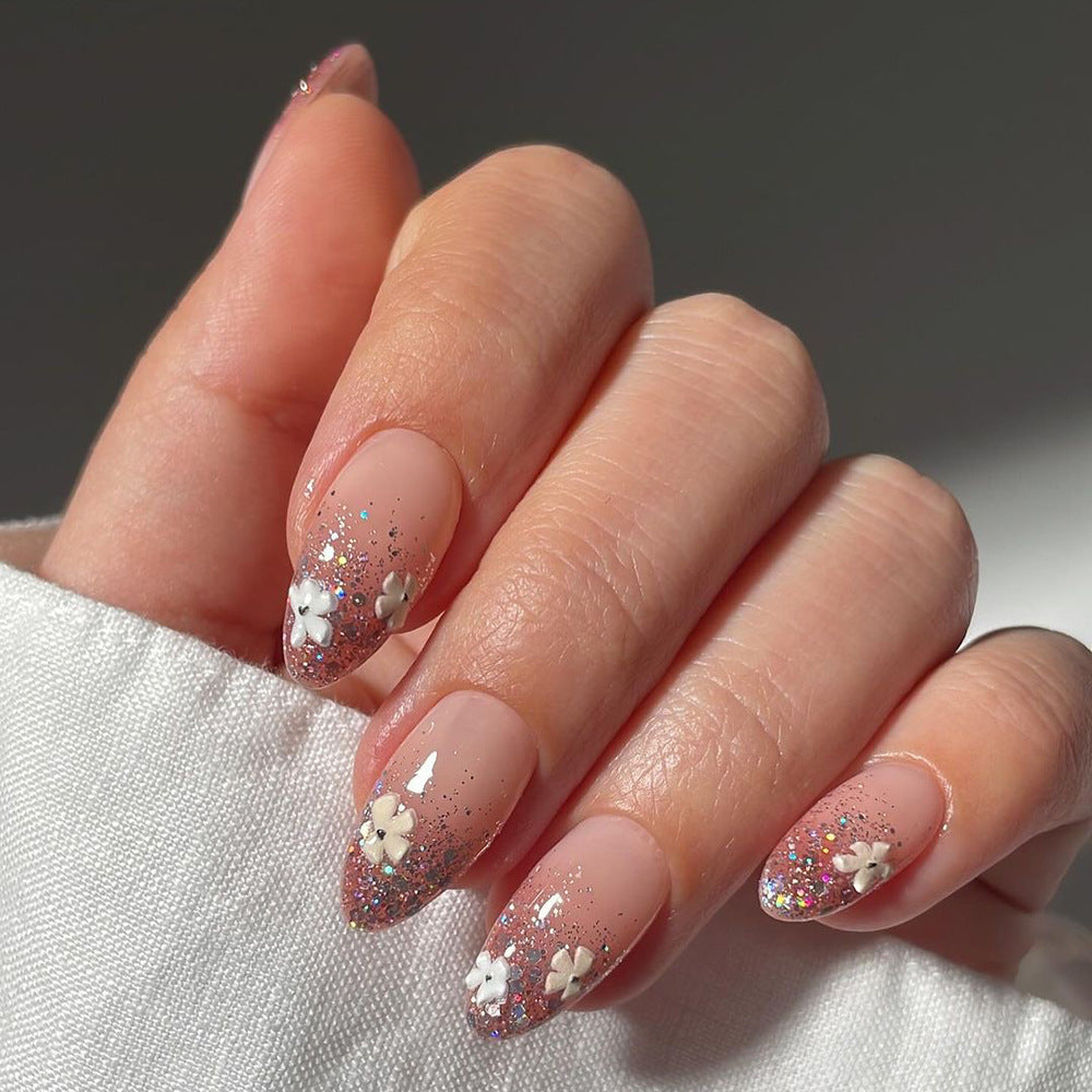 Glamorous nail extensions with glittering and floral design Kalsten