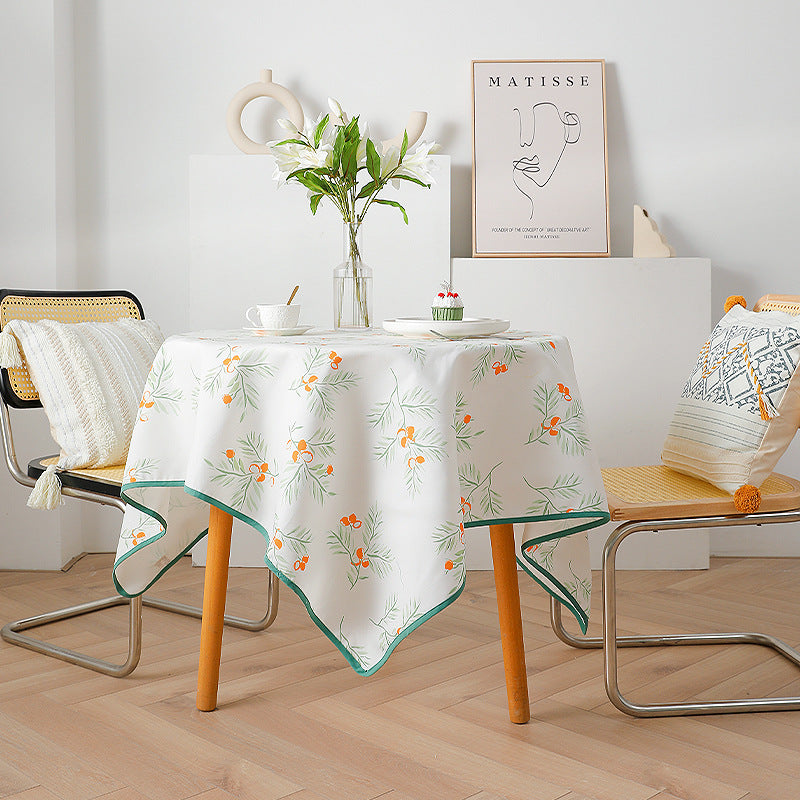 Rectangular tablecloth with botanical orange berry print and contrasting hem piping Kalsten