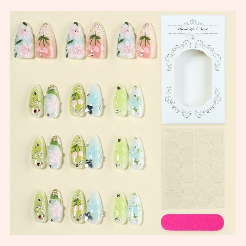 Acrylic nail set with handcrafted floral designs and glitter accents Kalsten