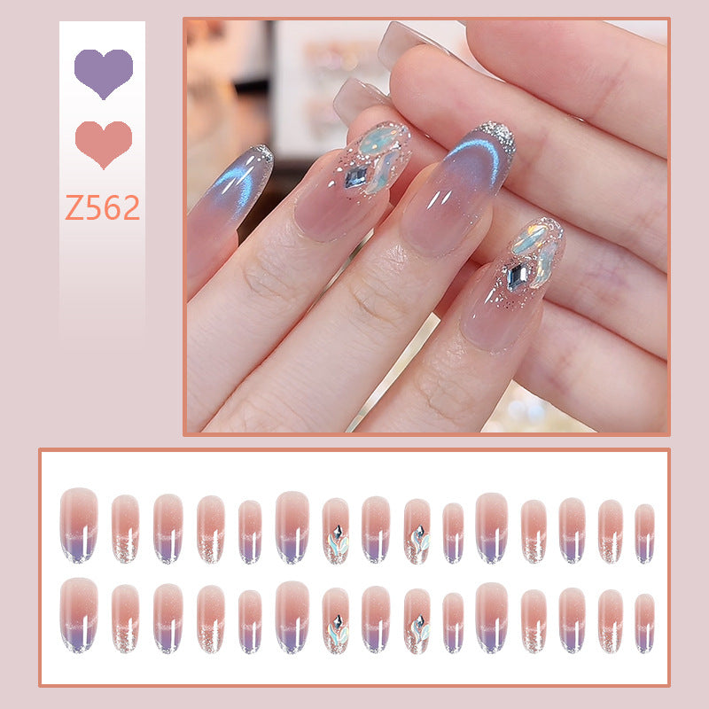 Acrylic nail set with elegant glitter effect and beautified embellishments Kalsten