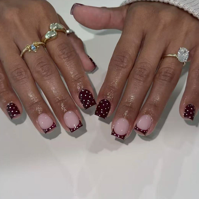 Artful nail art with elegant polka dot design Kalsten