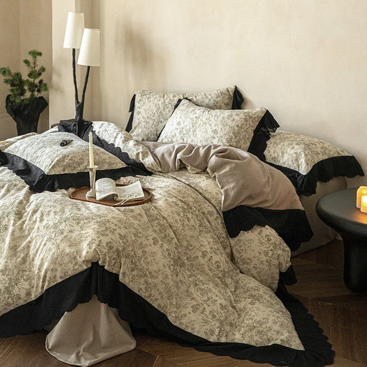 Bedding set with floral toile design and decorative lace trim