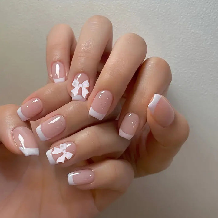 Elegant French Tip Nail Art with Bow Embellishments Kalsten