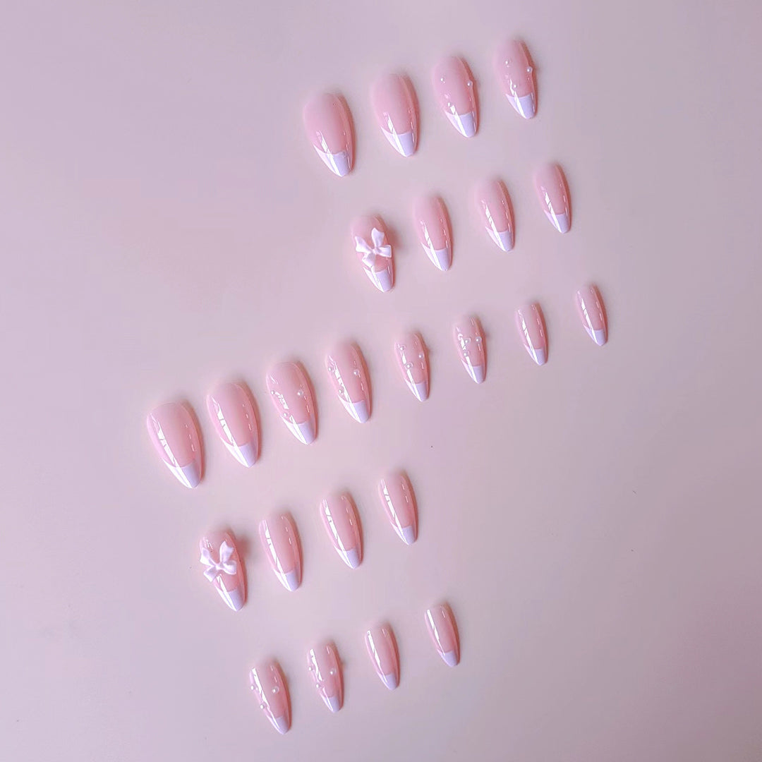 Artificial nail set with shimmering 3D bows and elegant pearl accents Kalsten