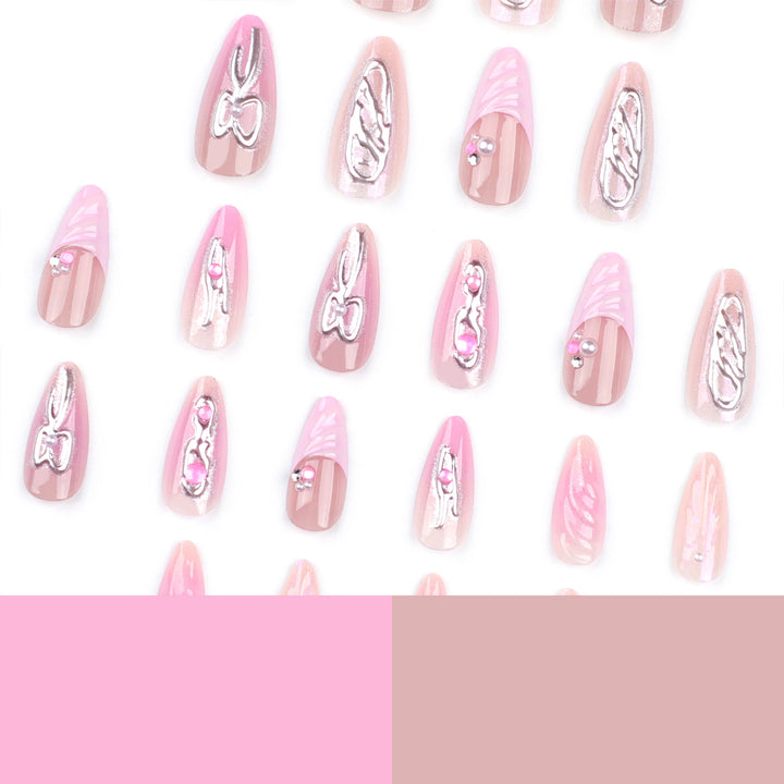 Artful stiletto nails with glitter and pearl decorations Kalsten