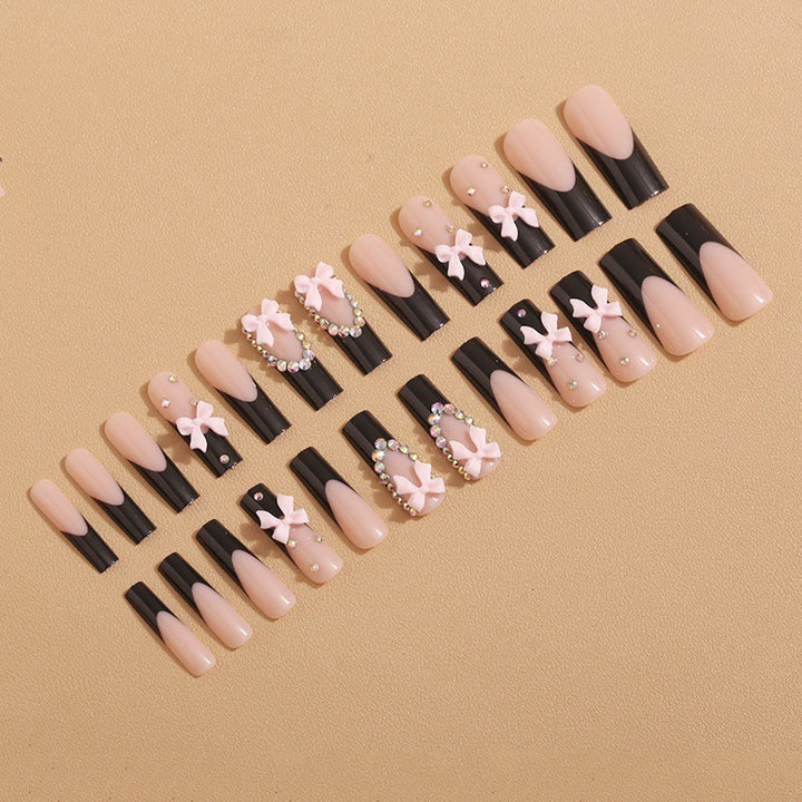 Artificial nails with elegant bows and rhinestone embellishments Kalsten