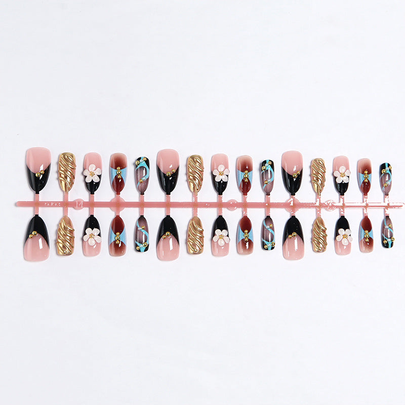 Artificial nail set with filigree floral decorations and glamorous accents Kalsten
