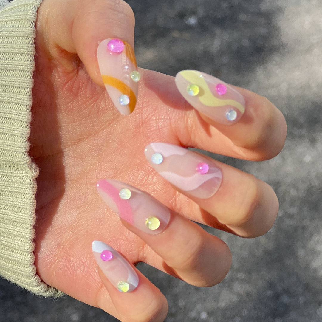 Artistic Nail Extensions with Colorful Design and Glitter Accents Kalsten