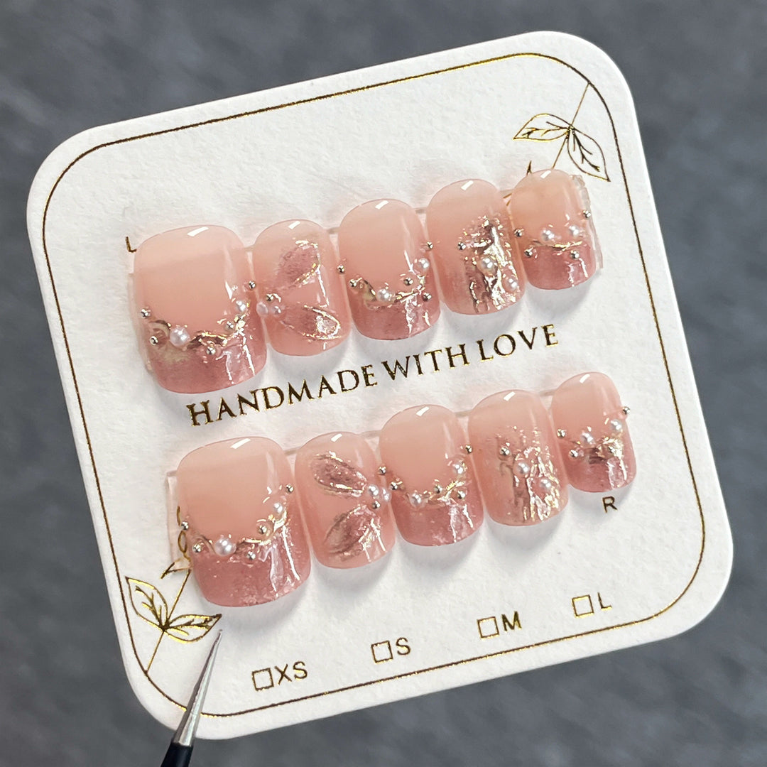Handmade art nails with delicate embellishments Kalsten