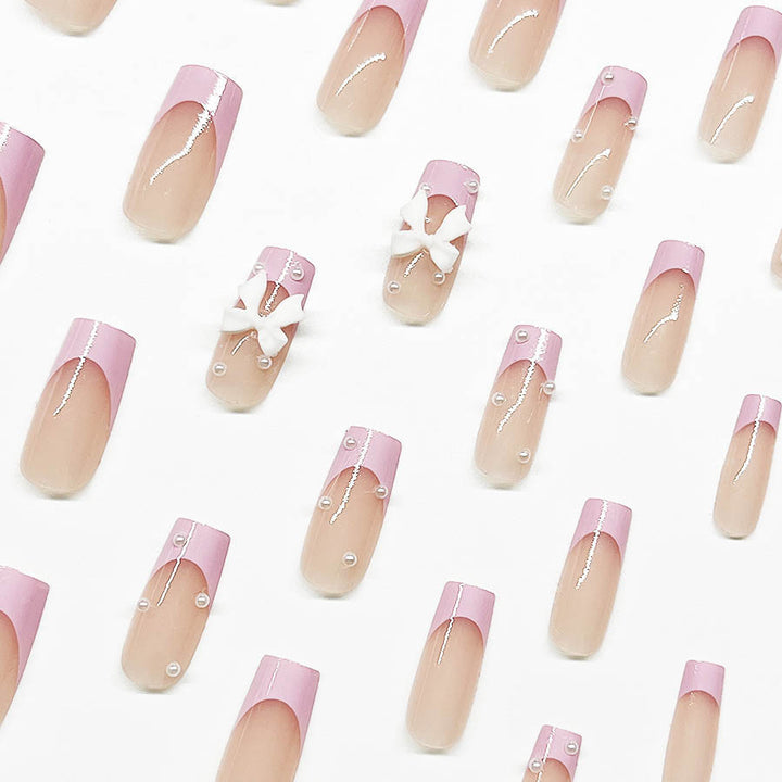 Artificial nail set with romantic bow and pearl embellishments Kalsten