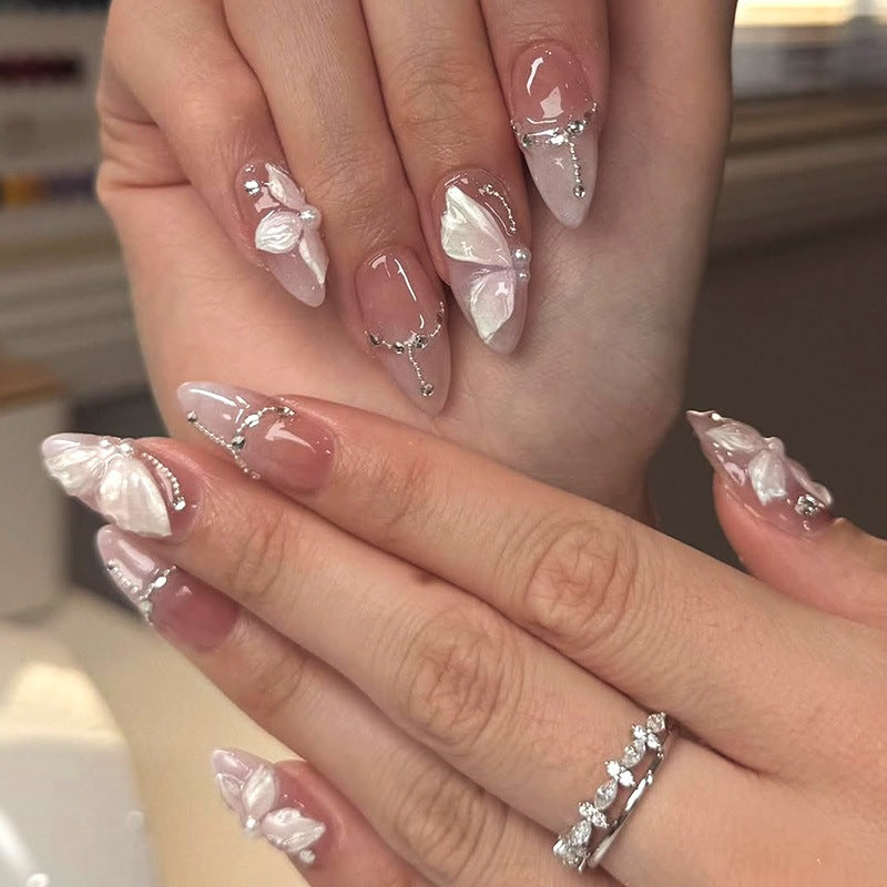 Artificial nails with delicate butterfly design and glitter accents Kalsten