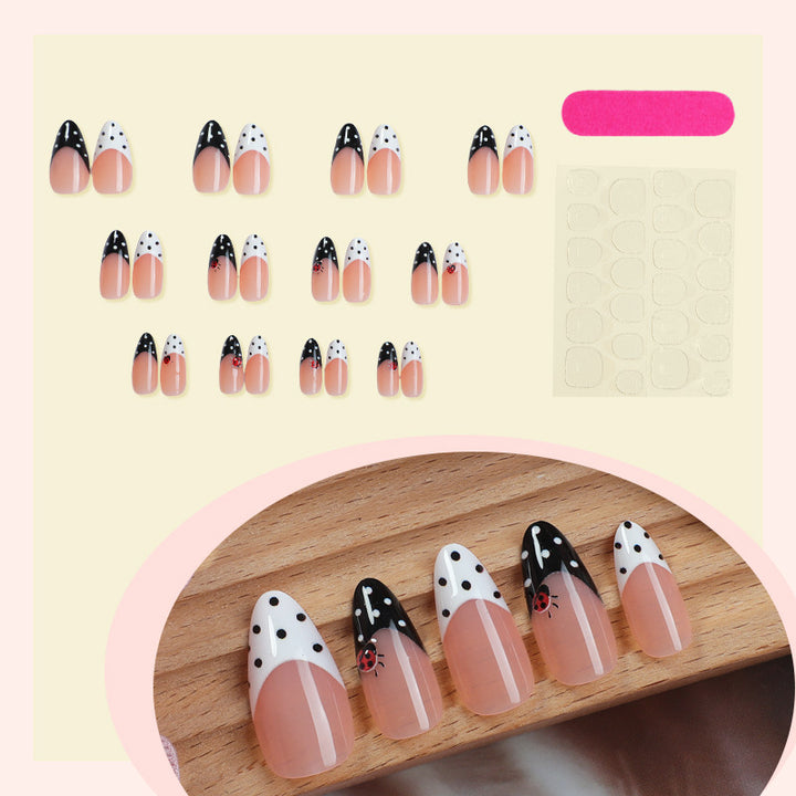 Acrylic nail set with polka-dotted accents and sparkling details Kalsten