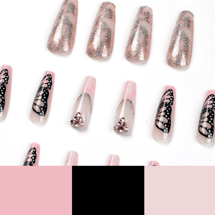 Glamorous nail extensions with beautiful butterfly motifs and glitter accents Kalsten