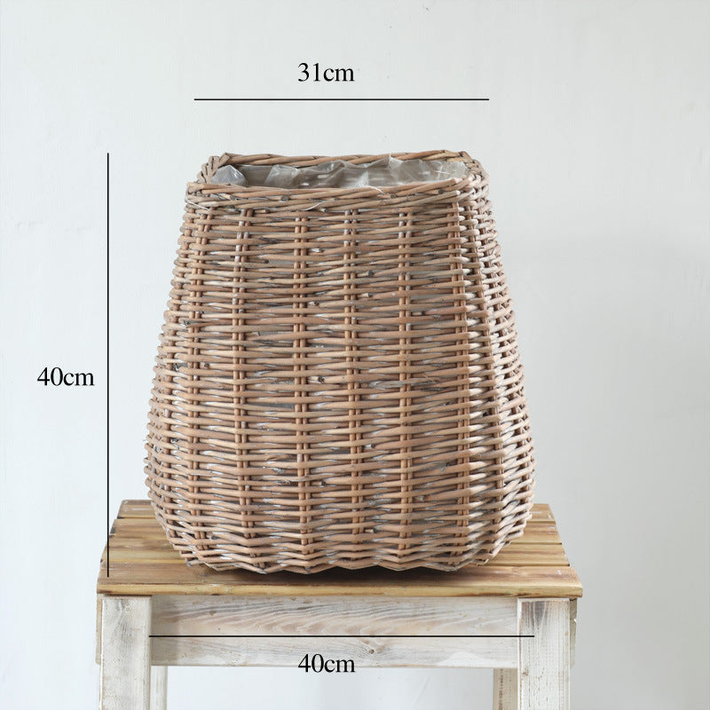 Stylish laundry basket made of braided natural material Kalsten