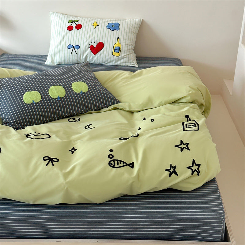 Playful cotton duvet cover set with embroidered motifs and soft fitted sheet