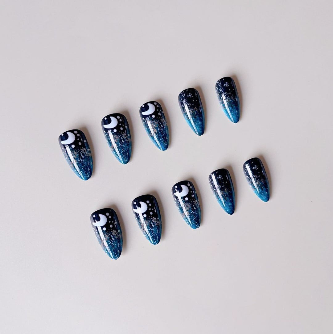 Glamorous artificial nails with sparkling star and moon motifs Kalsten