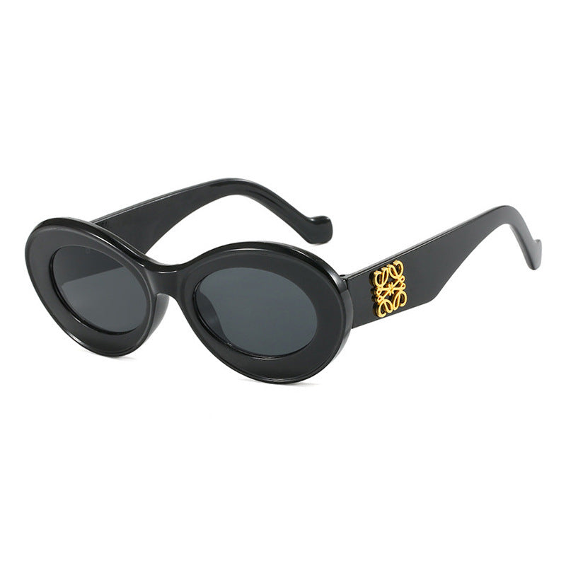 Women's fashionable sunglasses with oval frame and golden accents Kalsten