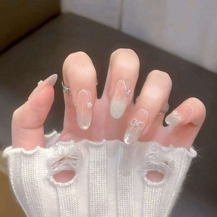 Decorative Press-On Nail Art with Bow and Gem Accents Kalsten